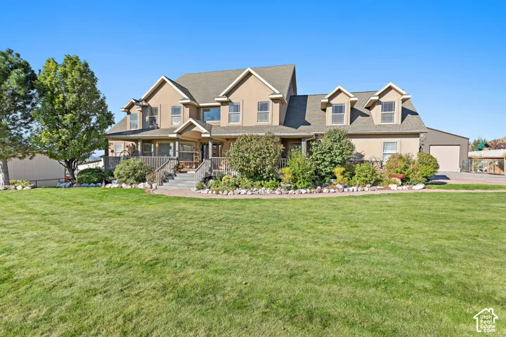 Expansive front lawn with mature trees and established landscaping