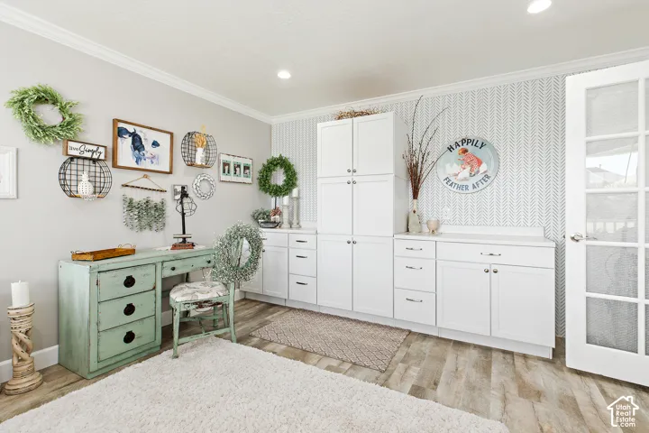Custom built-in white cabinetry with chrome hardware