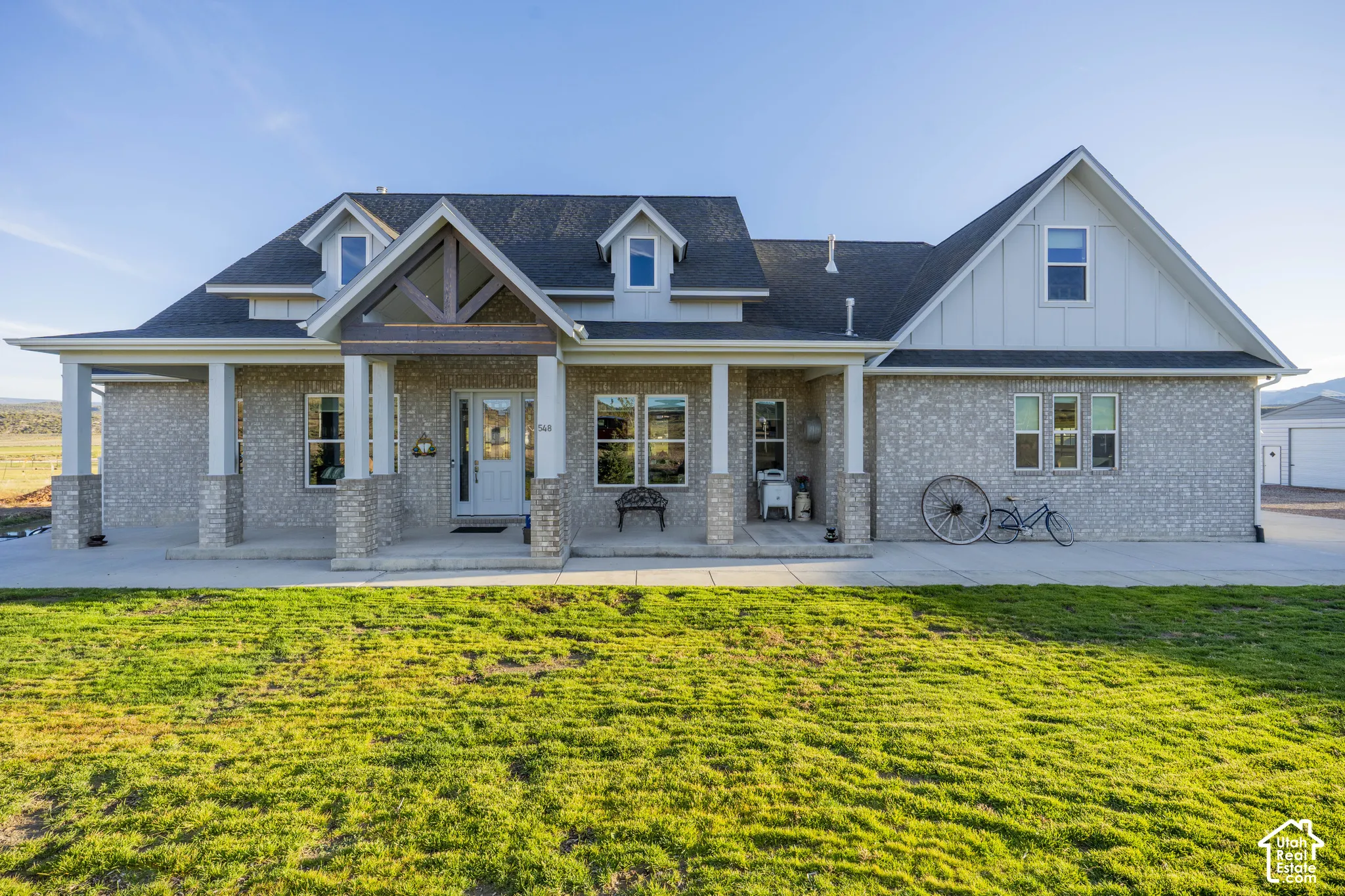Brick veneer facade with white siding accents