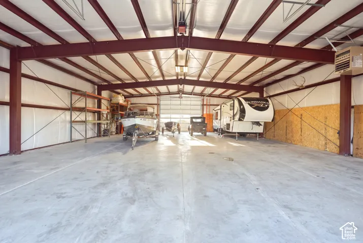 Metal frame building featuring high ceilings, concrete flooring, and insulated walls