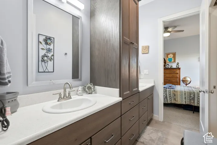 Double vanity with white solid surface countertops