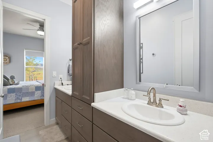 Dual vanity with white undermount sinks, brushed nickel fixtures, and light-toned countertops