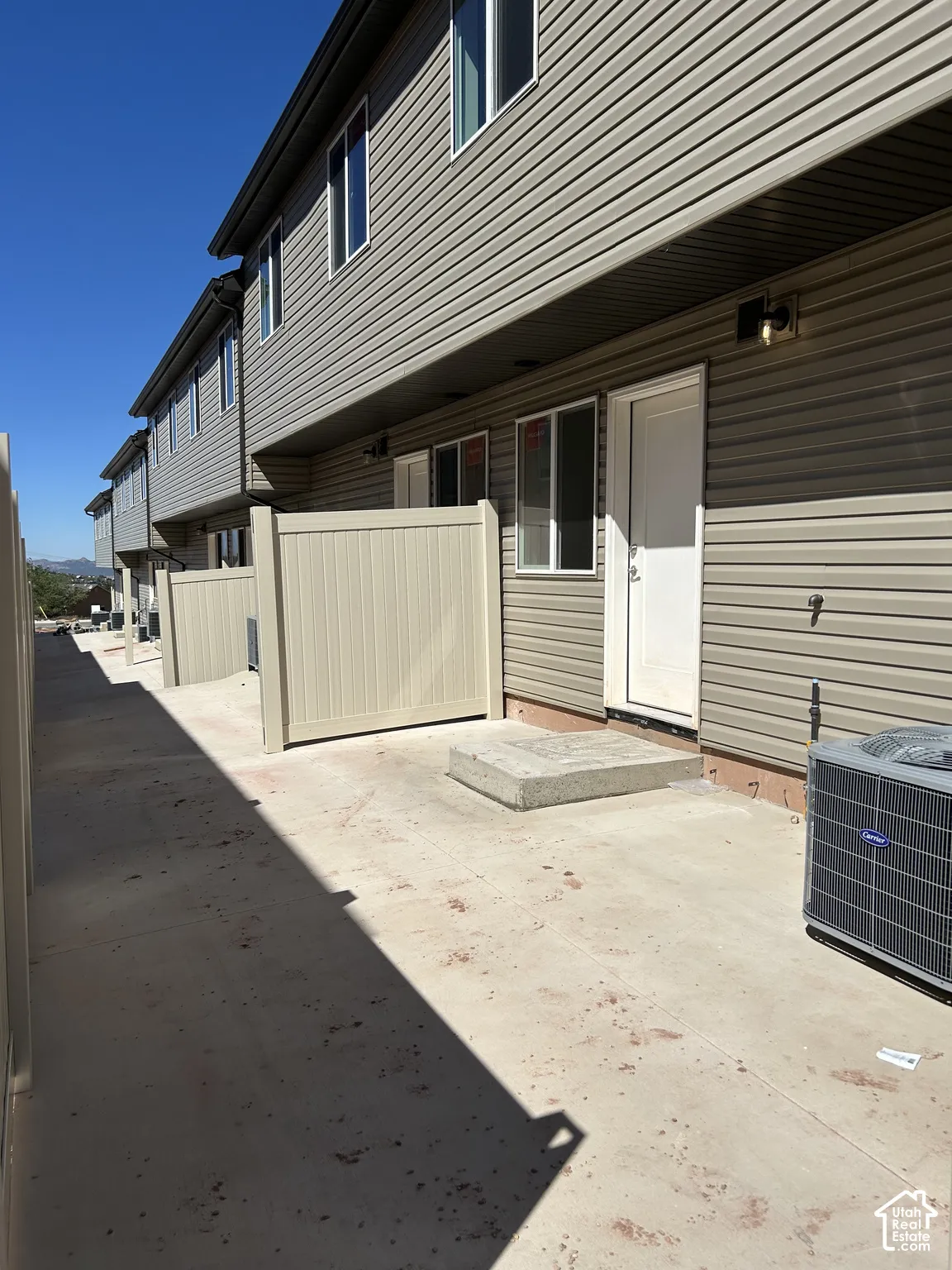 Private patio area featuring a concrete surface