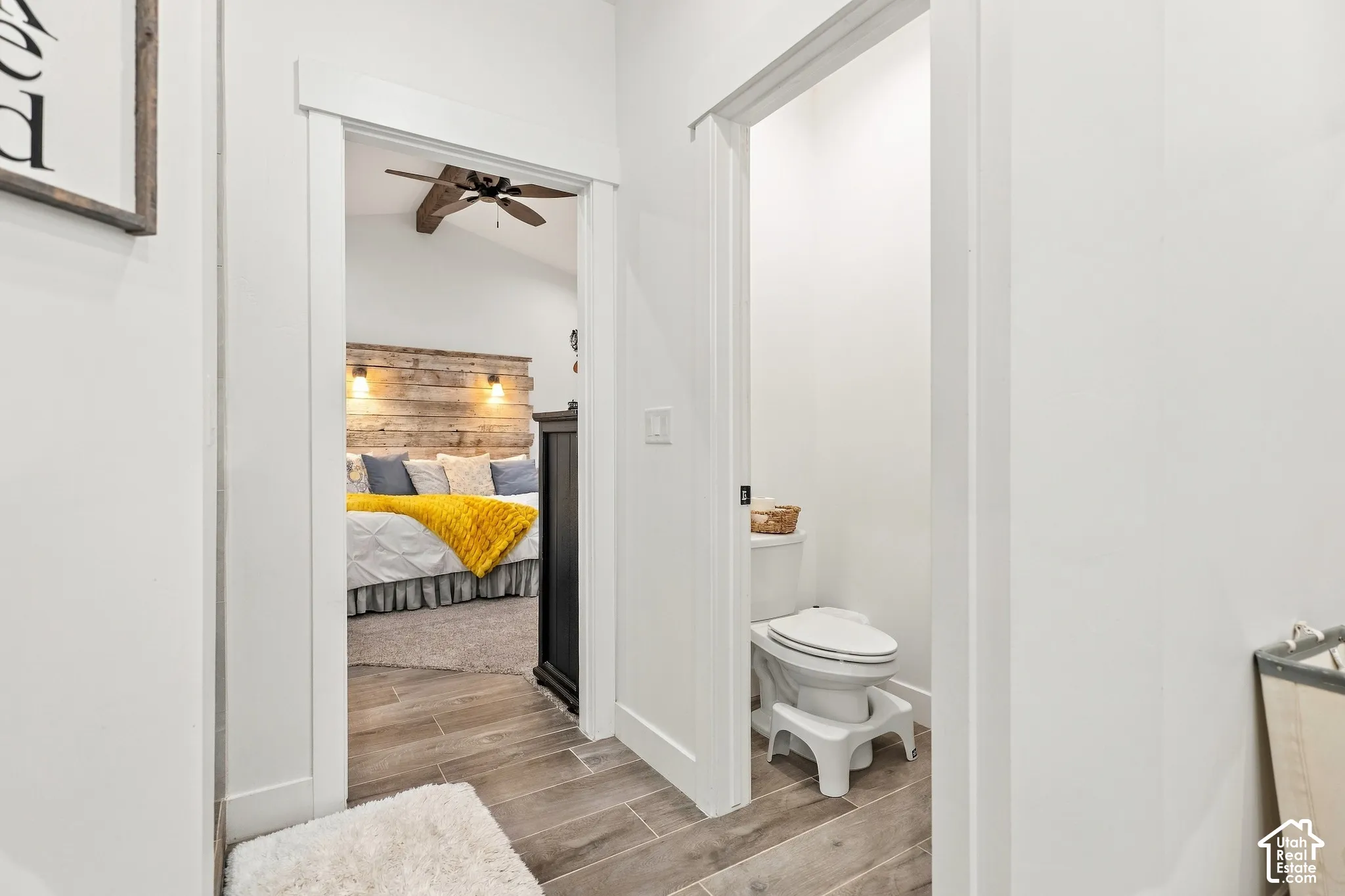 Wood-finish flooring throughout the hallway