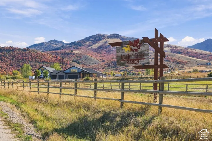 Wood-finish fence with a custom wooden sign