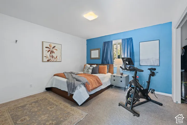 Carpeted flooring, recessed window, and flush-mount ceiling light fixture
