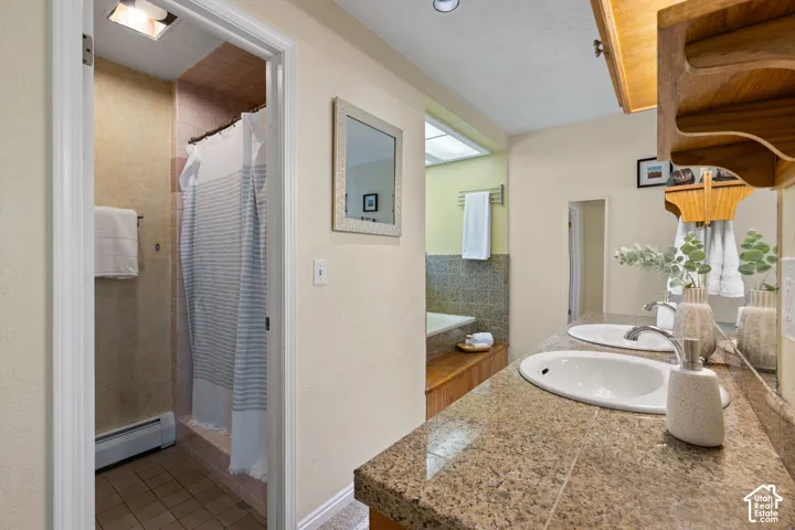 Double vanity with granite-style countertop and integrated sinks