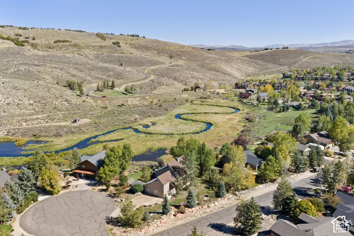 Hills surround this property with a winding waterway