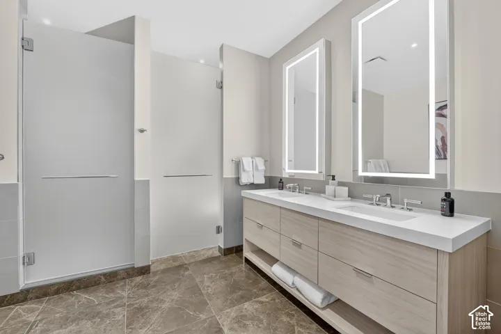 Dual vanity with integrated sinks and wall-mounted faucets