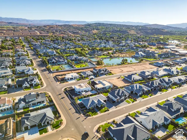 Expansive residential community featuring a variety of architectural styles, manicured landscaping, and mature trees