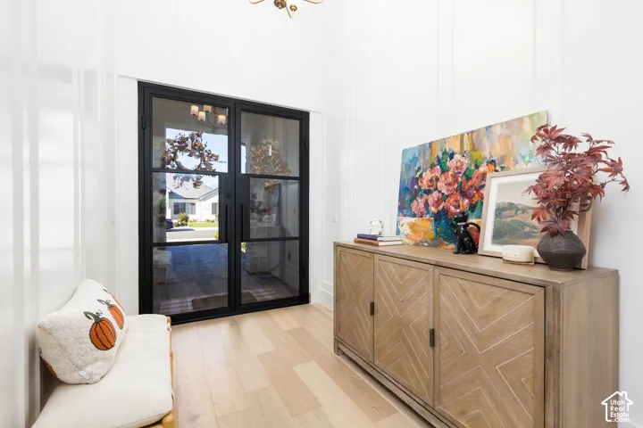 Double paneled glass entry doors with dark frames