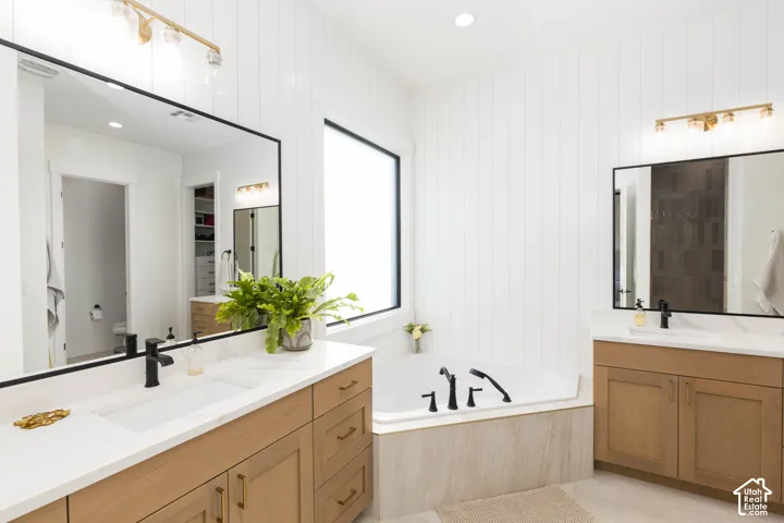 Dual vanities with integrated sinks and matte black fixtures