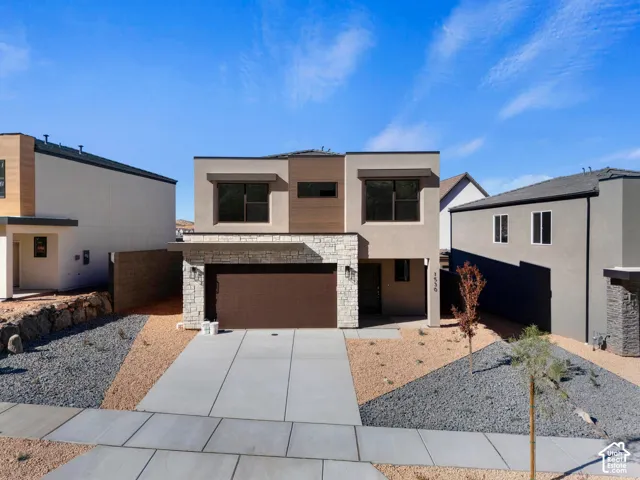 Contemporary exterior with stone veneer and wood-finish siding accents