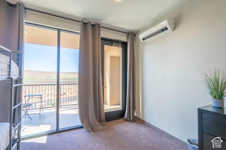 Sliding glass door leading to a private balcony with a metal railing