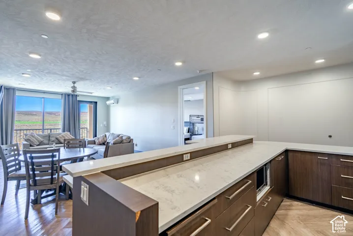 Open-concept living space featuring wood-finish flooring