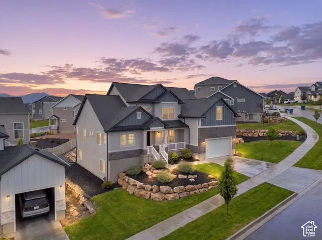 Contemporary two-story residence with attached two-car garage,  and tiered landscaping