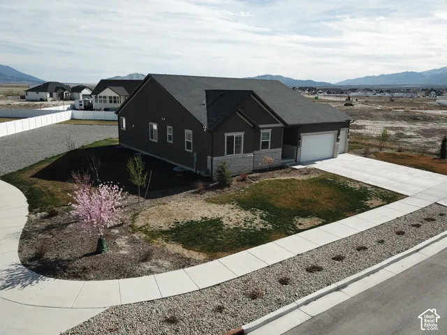 Contemporary exterior featuring dark siding and stone accents
