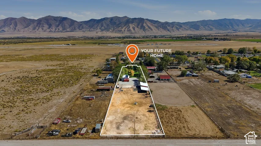 Expansive open land with a mountain backdrop