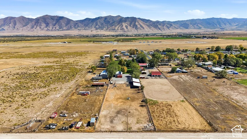Expansive landscape featuring distant mountains and a mix of developed and undeveloped land