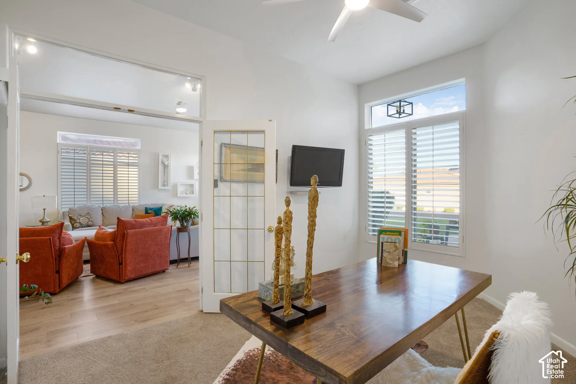 Window with plantation shutters and upper transom window