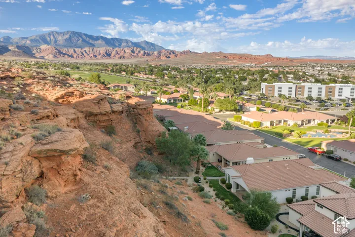 Red rock mountain backdrop with a townscape and golf course