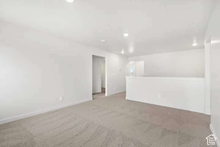 **DICSLAIMER** Interior package may vary.  Carpeted flooring, recessed lighting, white walls, and white trim