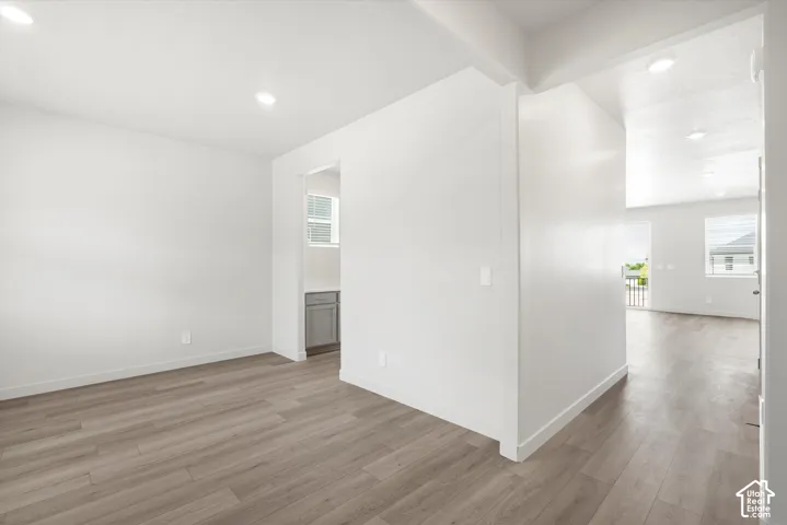 **DICSLAIMER** Interior package may vary.  Recessed lighting, light wood-finish flooring, white walls, and a window with horizontal blinds