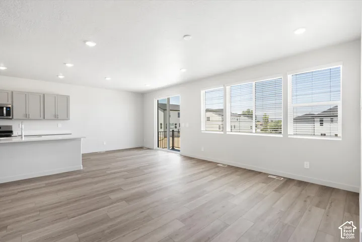 **DICSLAIMER** Interior package may vary.  Wood-finish flooring, recessed lighting, and a sliding glass door to the exterior