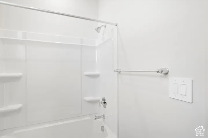 **DICSLAIMER** Interior package may vary.  White shower/tub combination with integrated shelving