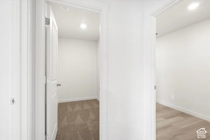 **DICSLAIMER** Interior package may vary.  Crisp white walls, recessed ceiling lighting, textured carpet, and wood-finish flooring