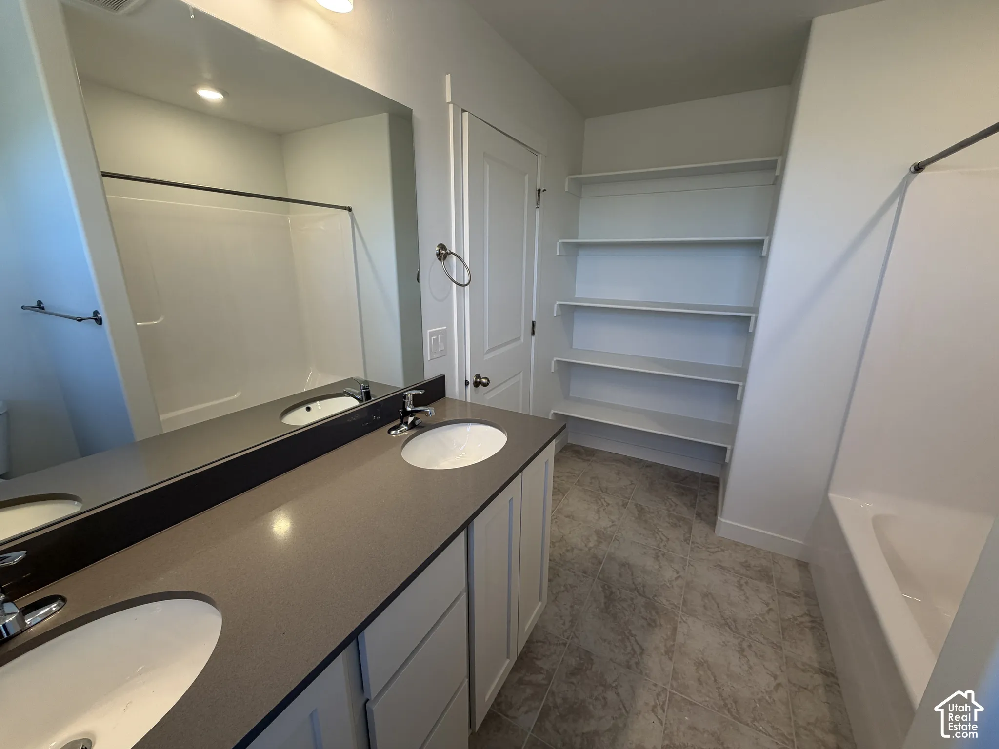 Dual vanity with undermount sinks and a solid surface countertop