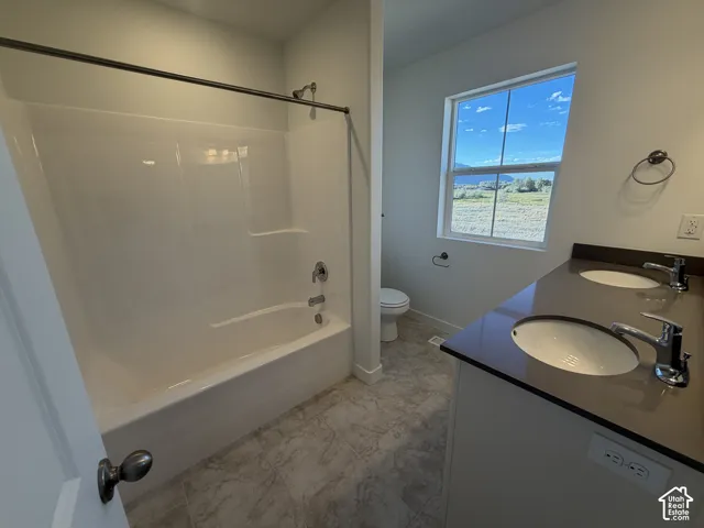 Dual vanity with undermount sinks, durable countertop, and chrome fixtures