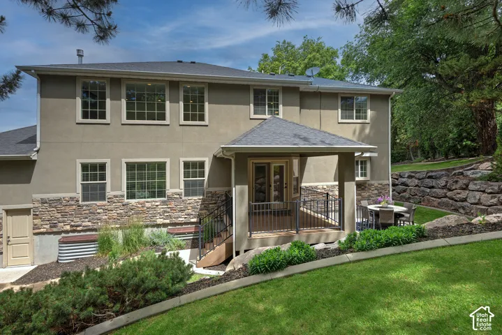 Stucco exterior with stone-finish wainscoting