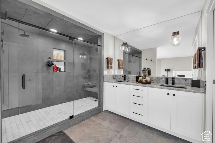 Dual vanity with stone countertops and undermount sinks