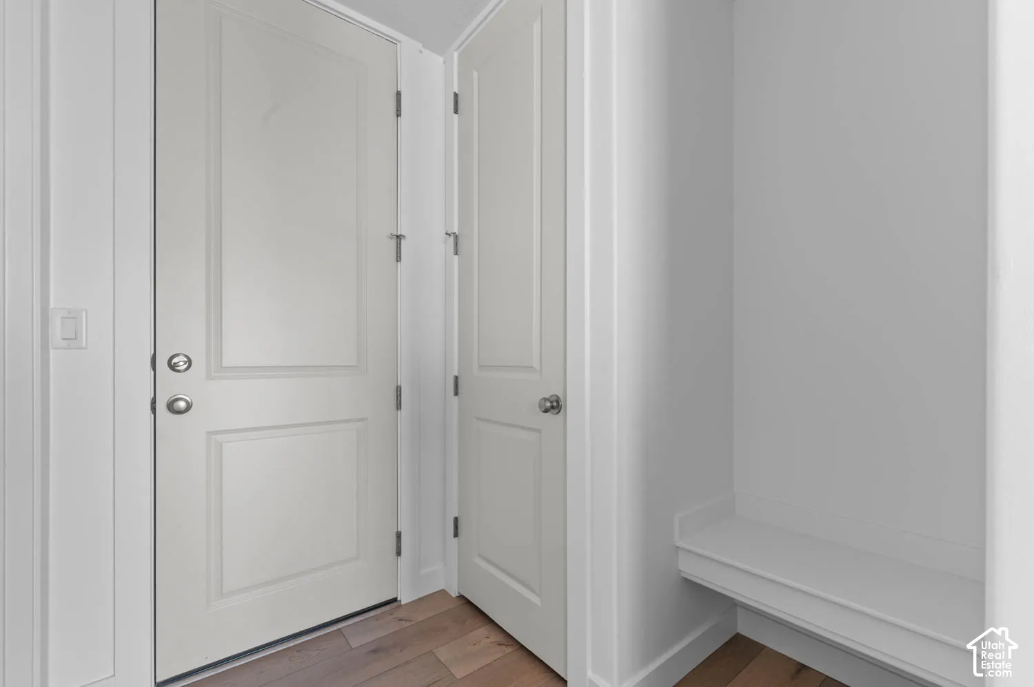 White paneled doors with chrome hardware
