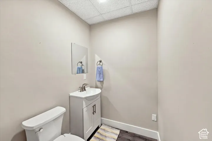 White vanity with integrated sink and chrome faucet