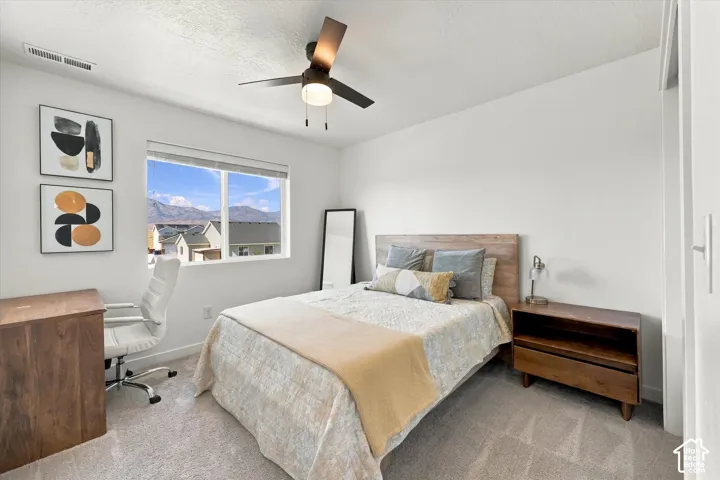 Bright interior with neutral wall finishes and carpet flooring
