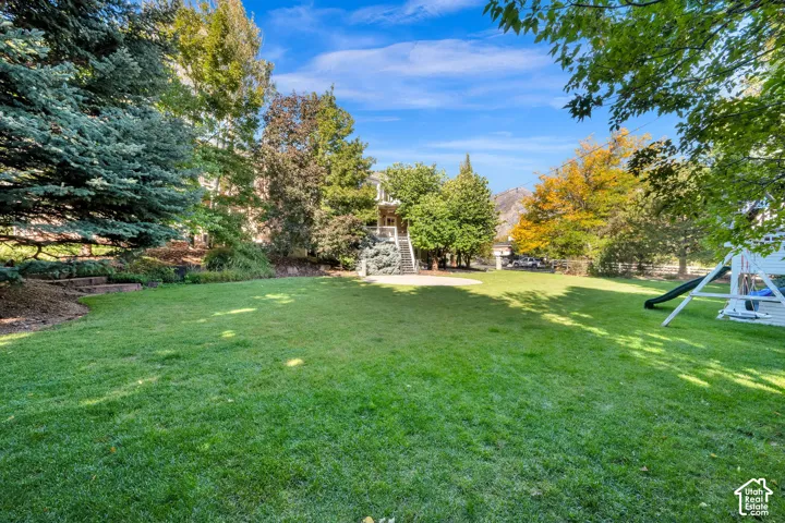 Expansive lawn surrounded by mature trees