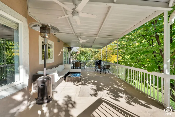 Covered outdoor patio with a durable railing system, ceiling fans, and a solid overhead structure