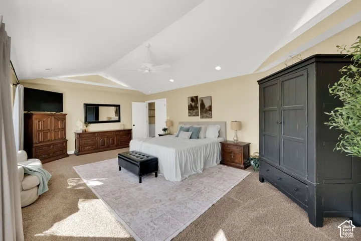 Tray ceiling with crown molding, recessed lighting, and a ceiling fan