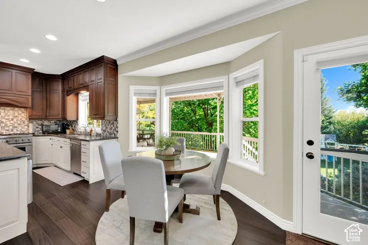 Dark wood-finish flooring with light-toned walls