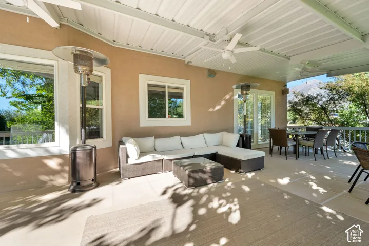 Expansive outdoor patio with a durable overhead covering and multiple ceiling fans