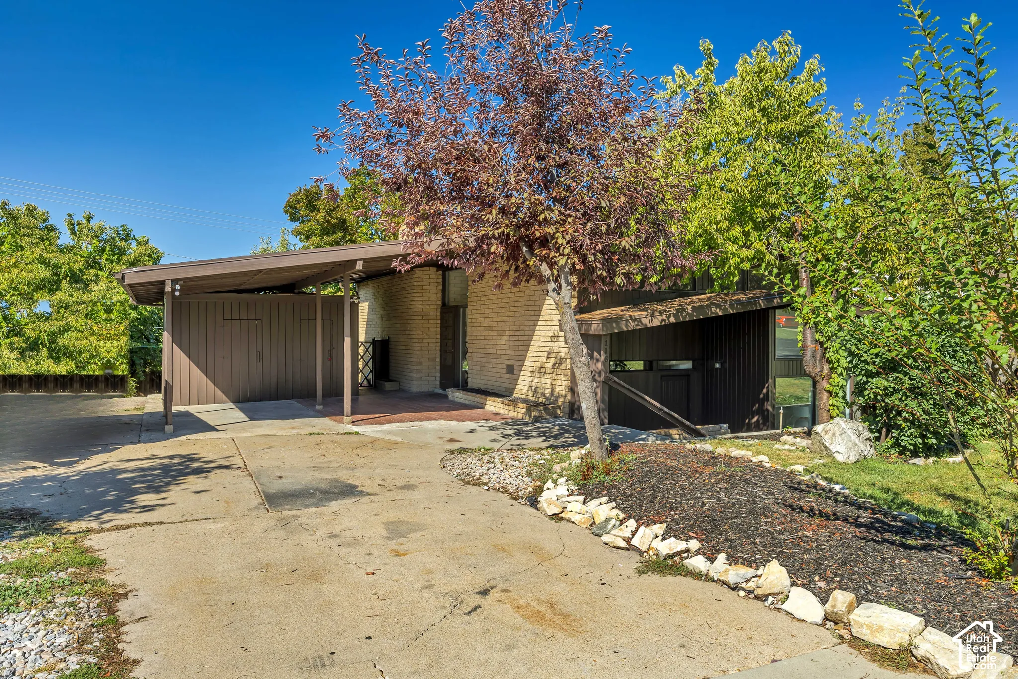 Mid-century modern architecture featuring brick and vertical siding