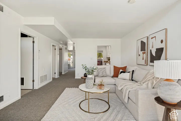 Bright living area with white walls and recessed lighting