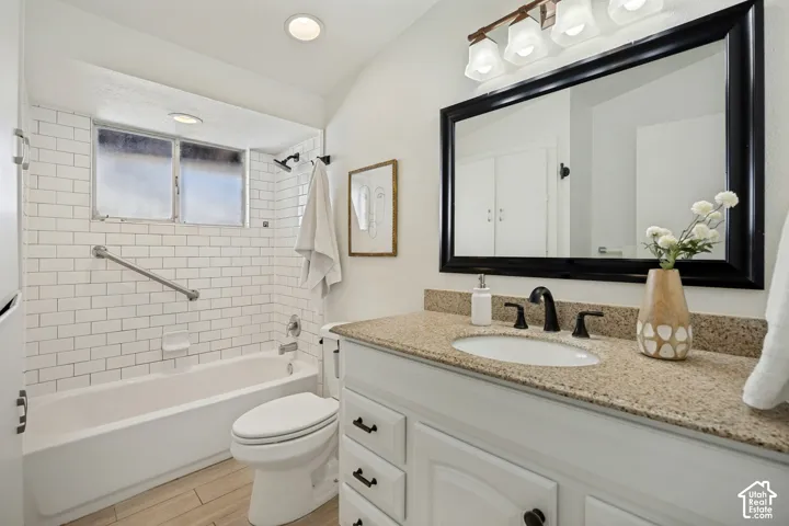 White subway tile shower surround with integrated grab bar and window