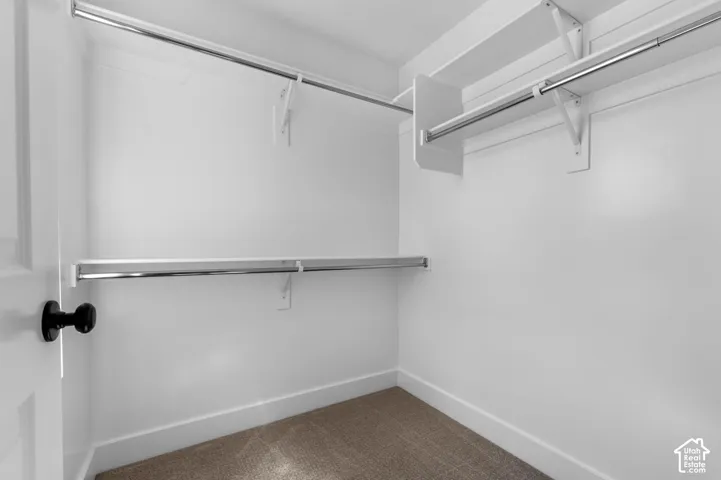 White painted walls with light brown carpeting