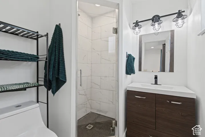 Enclosed shower with marble-look tile,