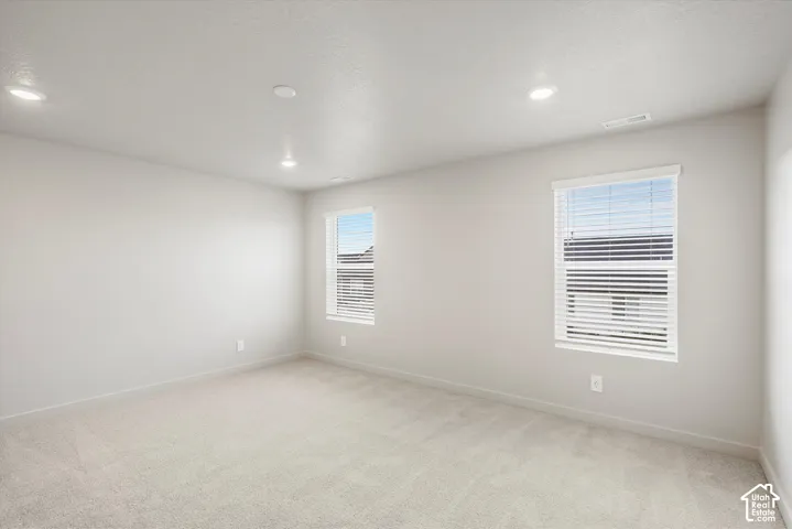 Neutral-toned carpeting throughout