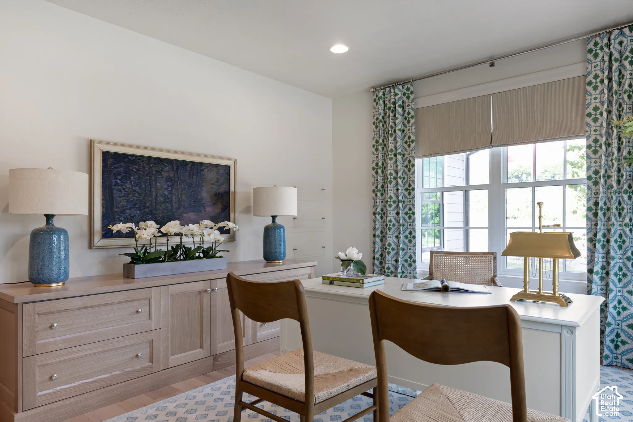 Recessed lighting illuminates wood-finish flooring and extensive built-in cabinetry