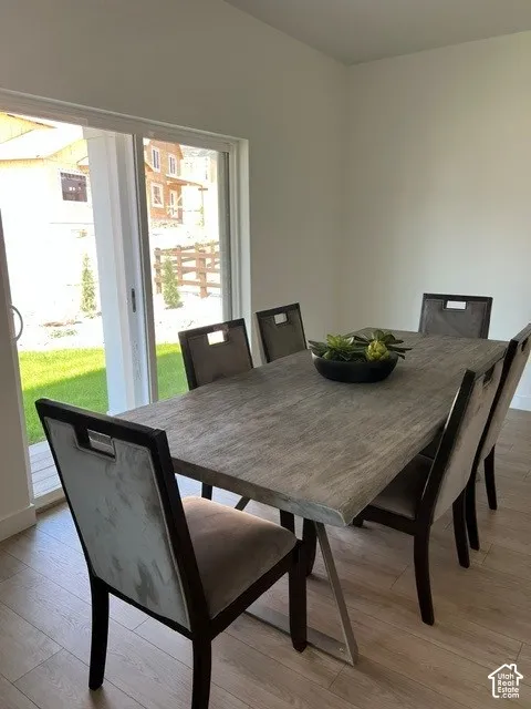 Wood-finish flooring with white walls and a sliding glass door